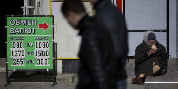 Merkelov�: E� je pripraven� potresta� Rusko ekonomick�mi sankciami